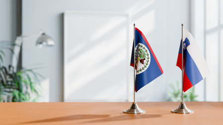 FLAGS OF BELIZE AND SLOVENIA ON TABLEの写真素材