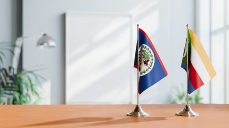 FLAGS OF BELIZE AND COMOROS ON TABLEの写真素材