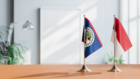 FLAGS OF BELIZE AND INDONESIA ON TABLEの写真素材