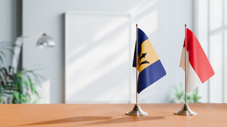 FLAGS OF BARBADOS AND MONACO ON TABLEの写真素材