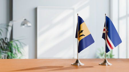 FLAGS OF BARBADOS AND CAPE VERDE ON TABLEの写真素材