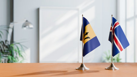 FLAGS OF  BARBADOS AND ICELAND  ON TABLEの写真素材