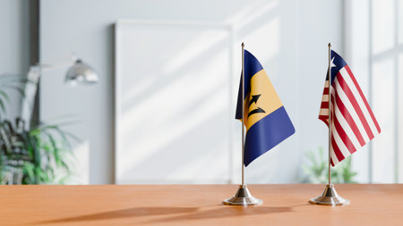 FLAGS OF BARBADOS AND LIBERIA ON TABLEの写真素材