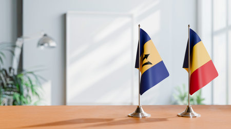FLAGS OF  BARBADOS AND ROMANIA  ON TABLE