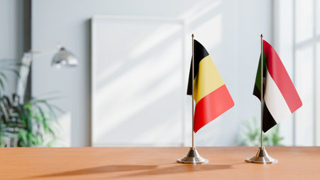 FLAGS OF  BELGIUM AND SUDAN  ON TABLEの写真素材