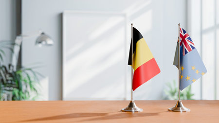 FLAGS OF BELGIUM AND TUVALU ON TABLE