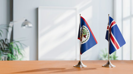FLAGS OF BELIZE AND ICELAND ON TABLEの写真素材