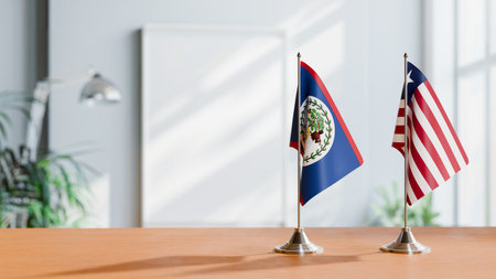 FLAGS OF BELIZE AND LIBERIA ON TABLEの写真素材
