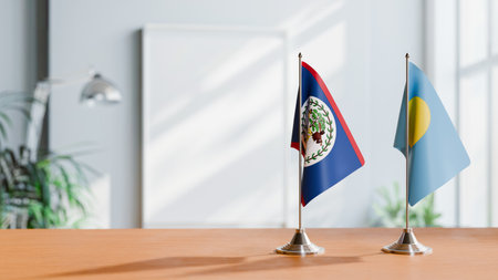 FLAGS OF BELIZE AND PALAU ON TABLEの写真素材