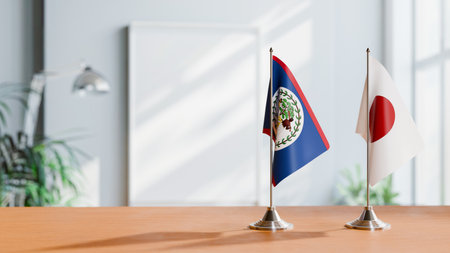 FLAGS OF BELIZE AND JAPAN ON TABLEの写真素材