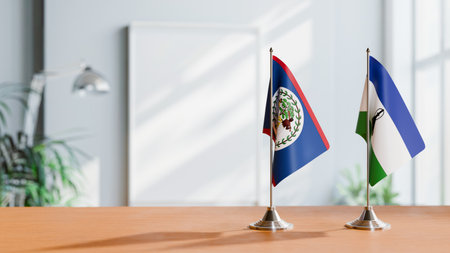 FLAGS OF BELIZE AND LESOTHO ON TABLEの写真素材