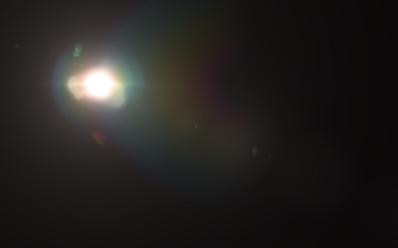 abstract thick lens flare light over black backgroundの写真素材