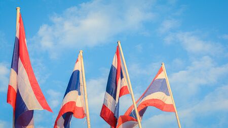 Thai flags wavy with sky backgroundの写真素材