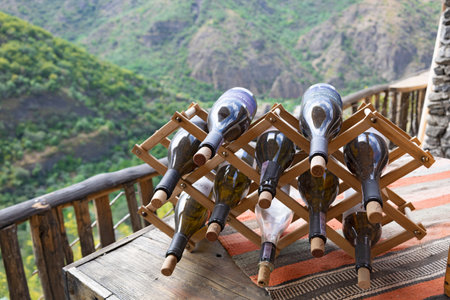 Wooden rack with empty wine bottlesの写真素材