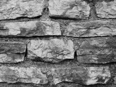 Stone Wall Castle Closeup. It is stone rough wall for pattern and background. Old gray stone wall background textureの写真素材
