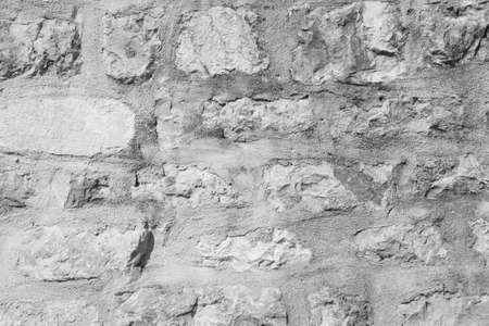 Stone Wall Castle Closeup. It is stone rough wall for pattern and background. Old gray stone wall background textureの写真素材