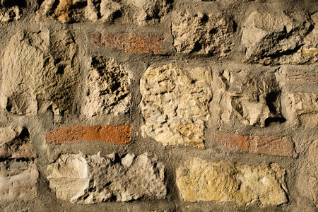 Stone wall texture with three new red bricksの写真素材