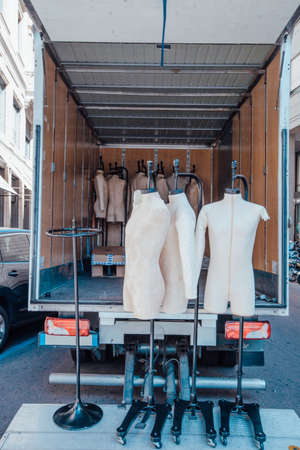 Male mannequins are unloaded from the carの写真素材