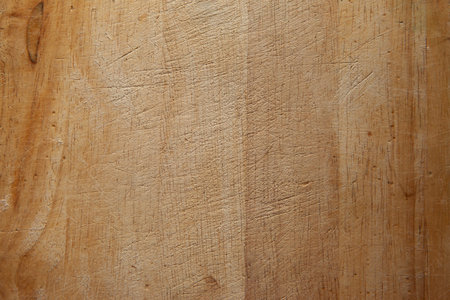 Surface of wooden cutting board, top view. Empty space. Place for text, design, presentation, for pictures of dishes in the restaurant. Food advertising. Texture of wooden chopping block.の写真素材