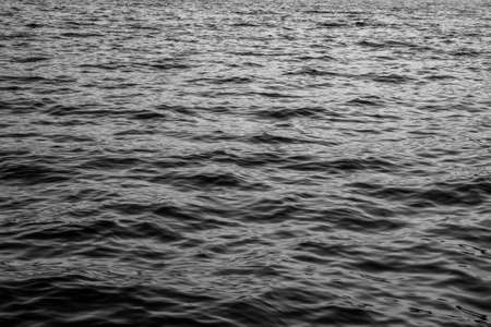Close-up sea background. A backing with sea waves texture for branding, calendar, postcard, screensaver, wallpaper, poster, banner, cover, website. A place for your design or textの写真素材