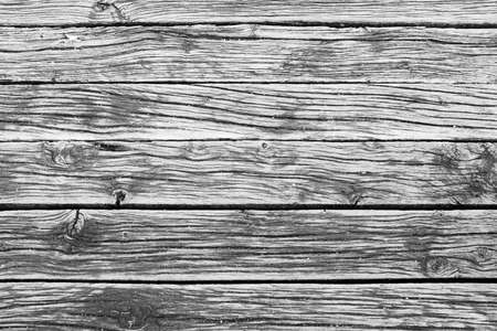 Old wooden planks for background design. A backing with wood surface for branding, calendar, postcard, wallpaper, poster, banner, cover, website. A place for your design or textの写真素材