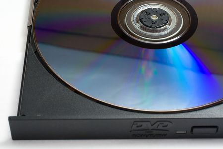 DVD disk in laptop DVD driveの写真素材