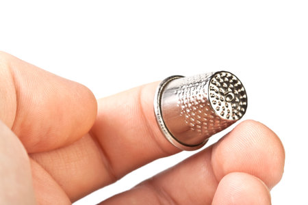 thimble on her finger