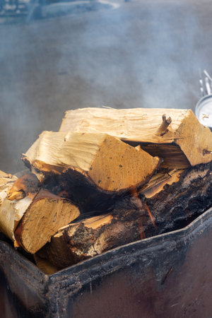 Burning firewood in a brazier, close-upの写真素材