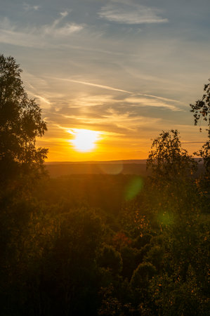 Beautiful sunset over the forest. Sunset over the forest. autumn landscape.の写真素材