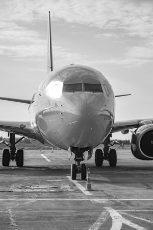 airplane in the airport, black and white photo with shallow depth of fieldの写真素材