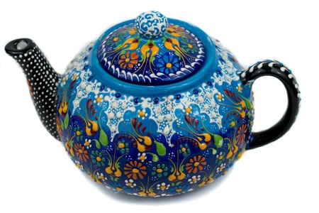 bright ceramic teapot with patterns on white backgroundの写真素材