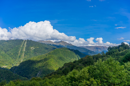 Mountain landscape against cloudy blue sky in Krasnaya Polyana Sochiの写真素材