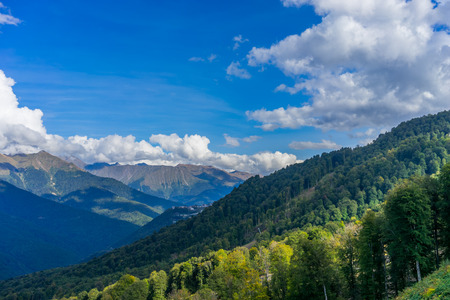 Mountain landscape against cloudy blue sky in Krasnaya Polyana Sochiの写真素材