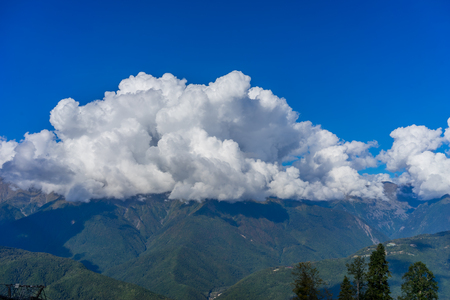 Mountain landscape against cloudy blue sky in Krasnaya Polyana Sochiの写真素材