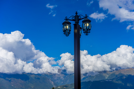 the lantern in the old style on the background of blue sky and clouds in Krasnaya Polyana Sochの写真素材