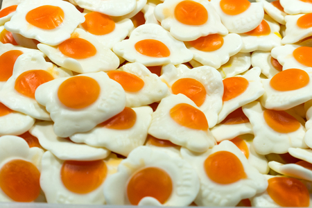 Yellow-white background of the marmalade in scrambled eggの写真素材