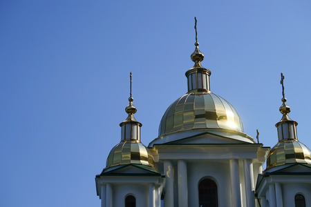 Glittering domes of a Christian Church on the background of blue cloudless skyの写真素材