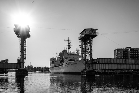 Kaliningrad, Russia - May 11, 2016: Research vessel between the two structures on the background of the river.のeditorial素材