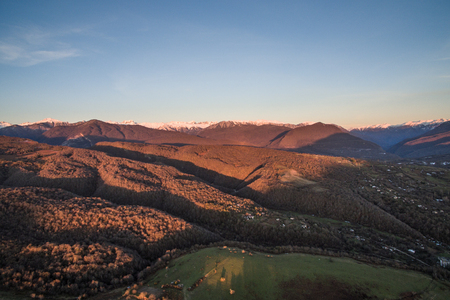landscape with heights with mountain views and vivid sunseの写真素材