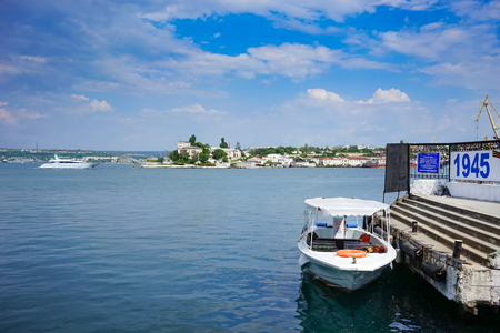 Sevastopol, Crimea-June 14, 2015: Passenger sea transport on the pier at the waterfront of the city.のeditorial素材