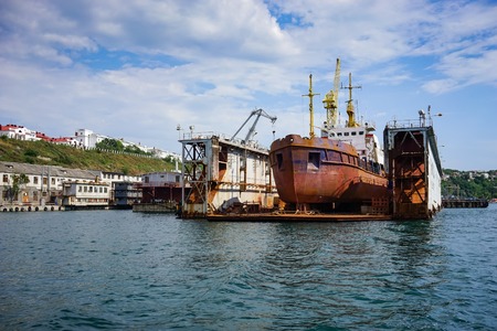 Sevastopol, Crimea-June 14, 2015: Seascape with ships at the pier against the horizon and the blue sky.のeditorial素材