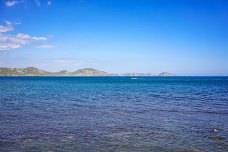 Koktebel, Crimea-June 27, 2015: Seascape with a view of the coastline and the calm blue sea.の写真素材