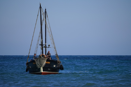 Koktebel, Crimea-June 27, 2015: Tourist ship in vintage style on the background of blue sea and horizon.のeditorial素材
