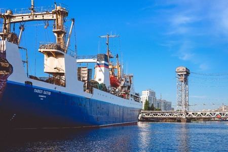 Kaliningrad , Russia-may 11, 2016: Port of a large Russian city with ships and various equipment on the background of the river.のeditorial素材