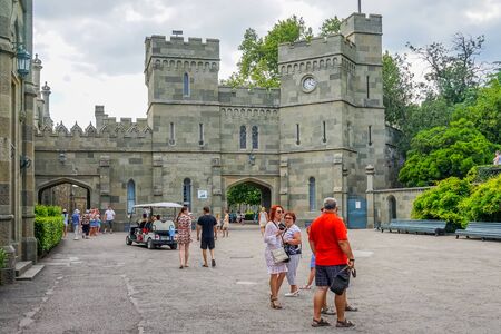Yalta, Crimea - June 22, 2015: People walk around the yard Vorontsov Palace, located in the middle of a green Park.のeditorial素材