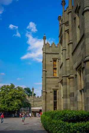 Yalta, Crimea - June 22, 2015: People walk around the yard Vorontsov Palace, located in the middle of a green Park.のeditorial素材