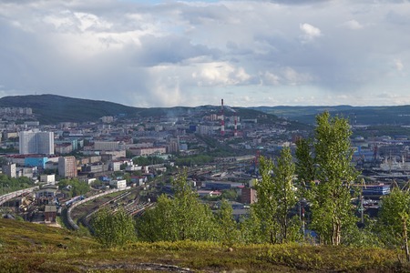 Murmansk, Russia-June 5, 2015: The urban landscape of the Murmansk Soviet architecture and the bright foliage of summer.の写真素材