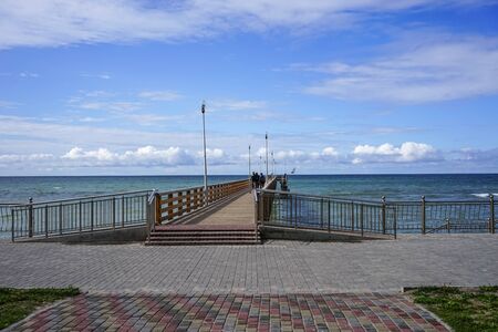 Zelenogradsk, Russia-may 17, 2016: Seascape overlooking the long pier of the resort town with walking people.のeditorial素材