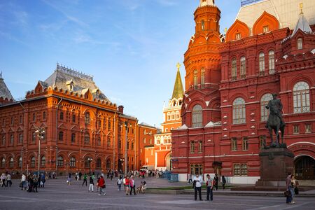Moscow, Russia - June 2, 2015: The citys architecture with historic buildings and a monument to Marshal Zhukov walking with people in the evening hours.のeditorial素材