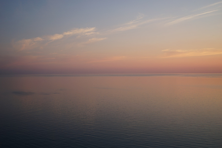 Delicious delicate sunset over a calm seaの写真素材
